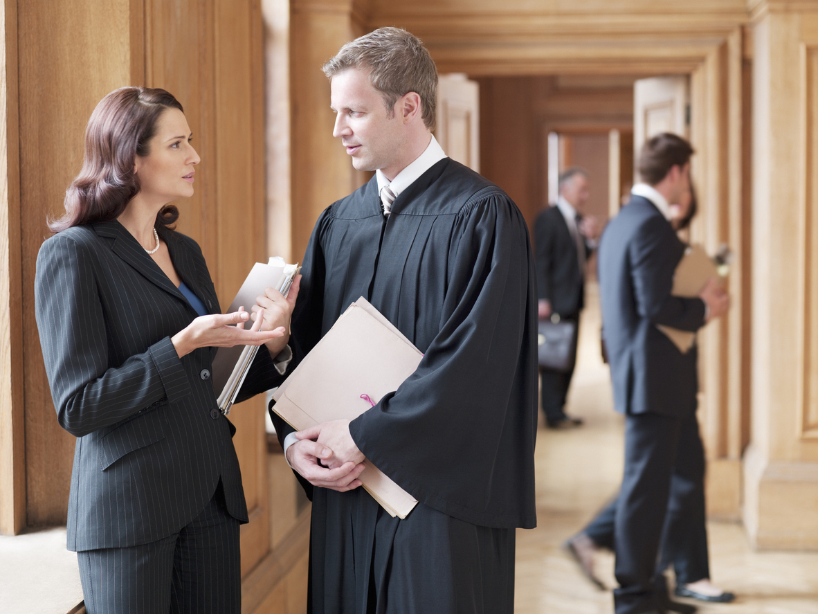 Solicitor and Barister meeting in corridor