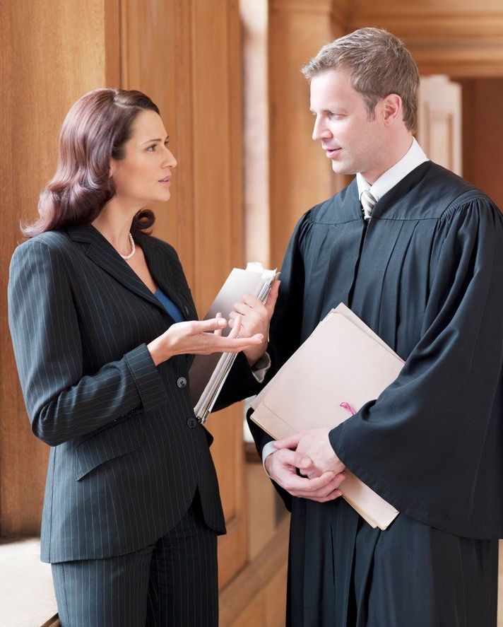 Legal professionals walking past Norango.ai branding