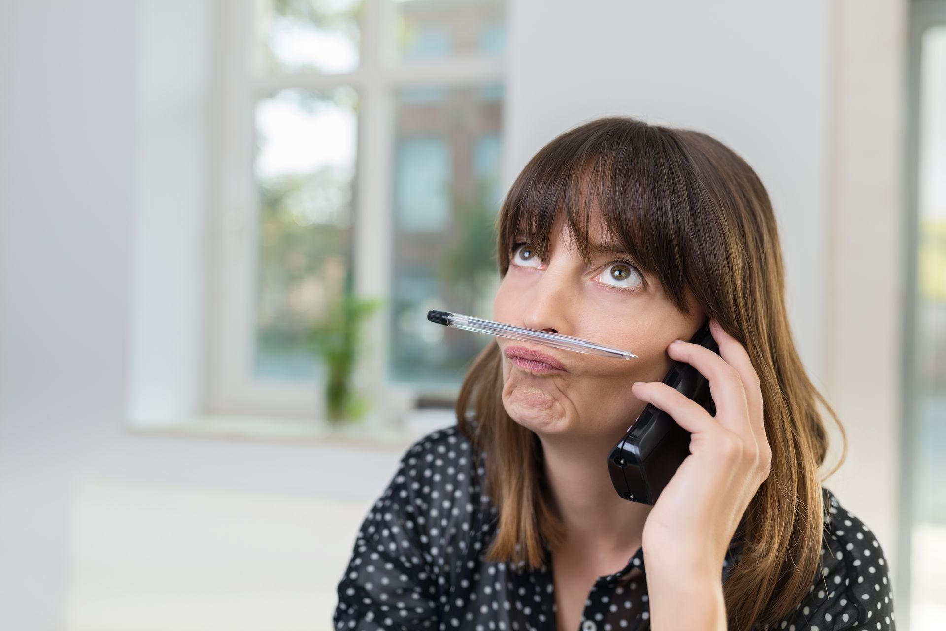 woman bored with waiting on the line