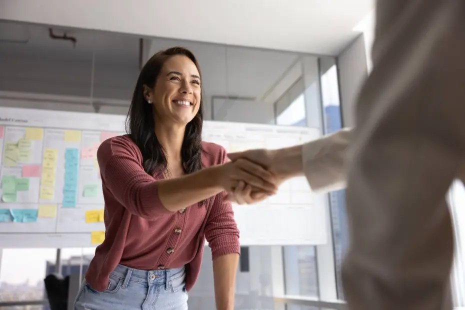 Recruiter shaking hands with candidate